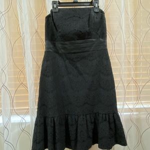 Black dress without tag but never worn.